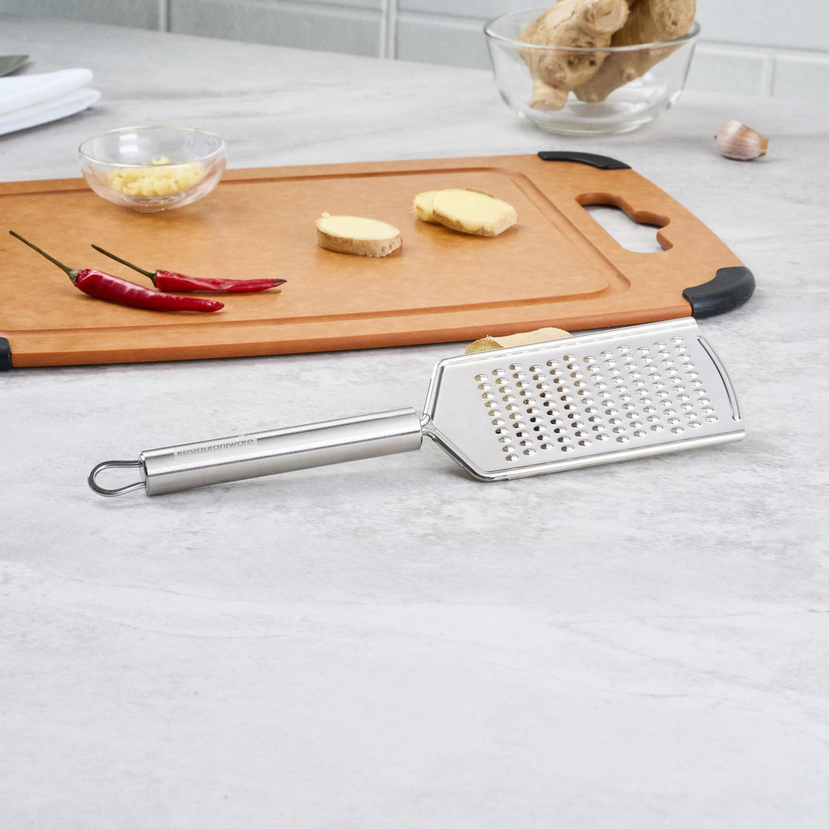 Restaurantware Stainless Steel Fine Cheese Grater - German Standard Lemon Zester with Ergonomic Handle, Sharp Blades, Dishwasher Safe - Handheld Kitchen Grater for Parmesan, Garlic, Ginger
