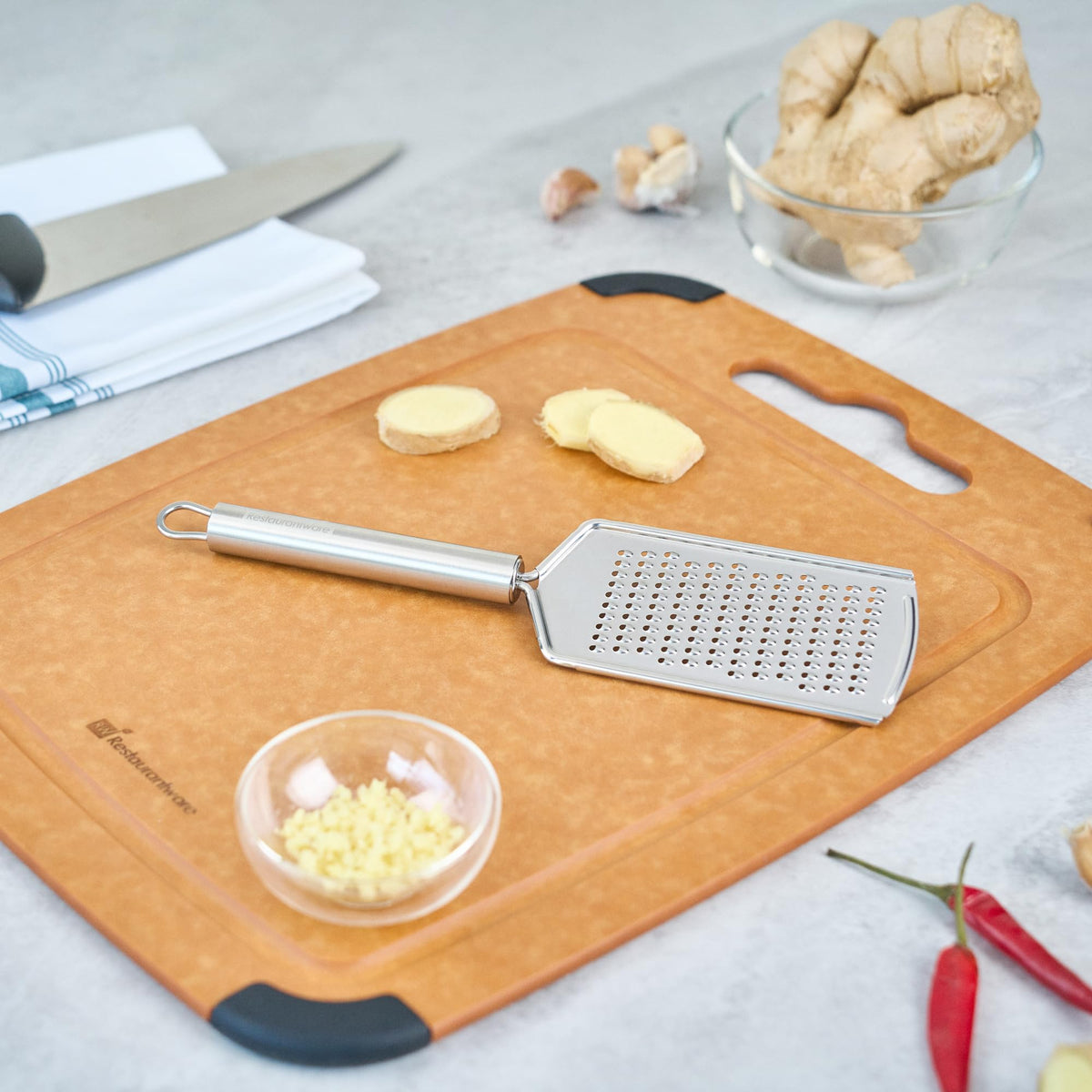 Restaurantware Stainless Steel Fine Cheese Grater - German Standard Lemon Zester with Ergonomic Handle, Sharp Blades, Dishwasher Safe - Handheld Kitchen Grater for Parmesan, Garlic, Ginger