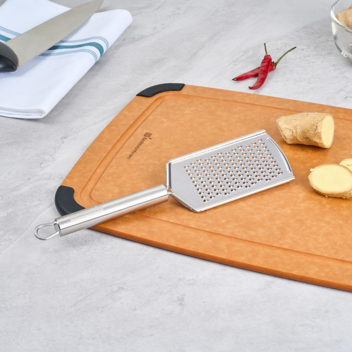 Restaurantware Stainless Steel Fine Cheese Grater - German Standard Lemon Zester with Ergonomic Handle, Sharp Blades, Dishwasher Safe - Handheld Kitchen Grater for Parmesan, Garlic, Ginger